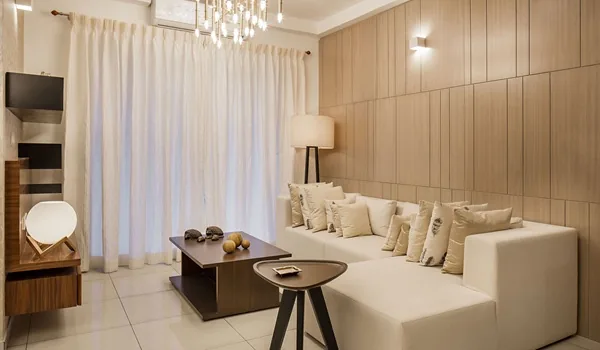 Living room interior with seating, natural light and neutral finishes