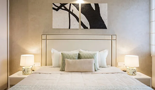 Master bedroom with a double bed, wardrobe run and bedside lighting