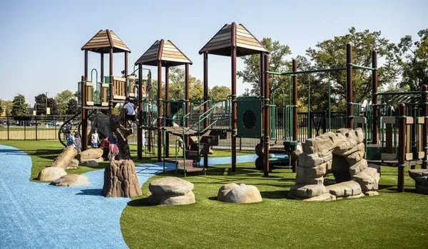 Landscaped recreation area with seating, pathways and dense planting