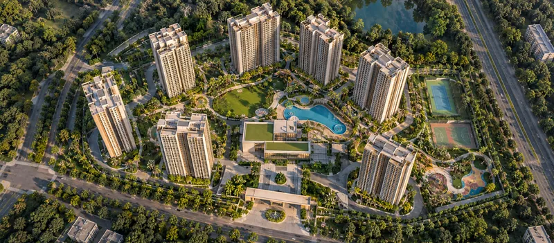 Overhead view of towers arranged around a central landscaped amenity core