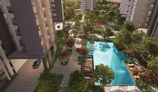 Outdoor swimming pool bordered by a paved deck and loungers